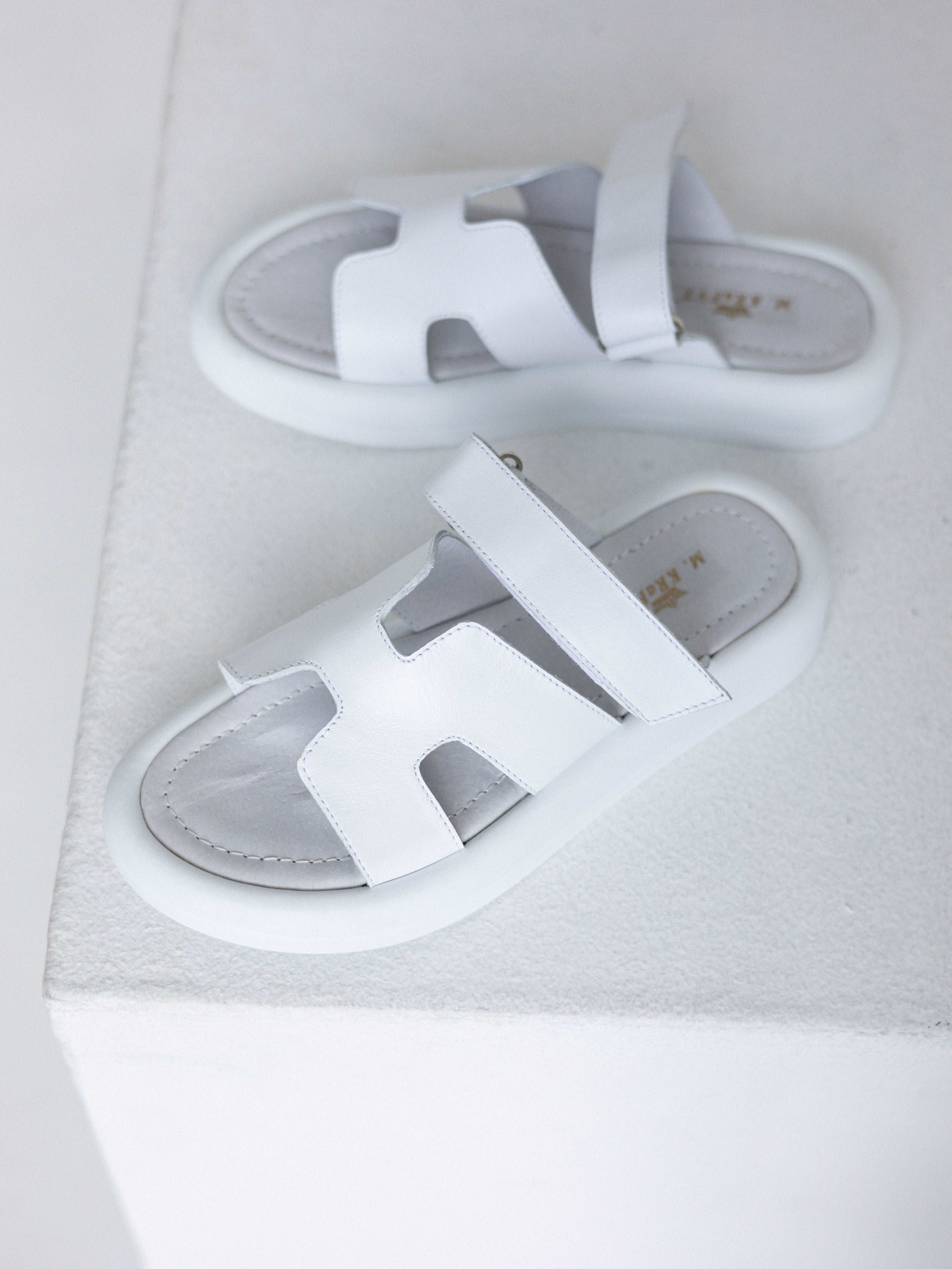 stylish white flip-flops with a fastener