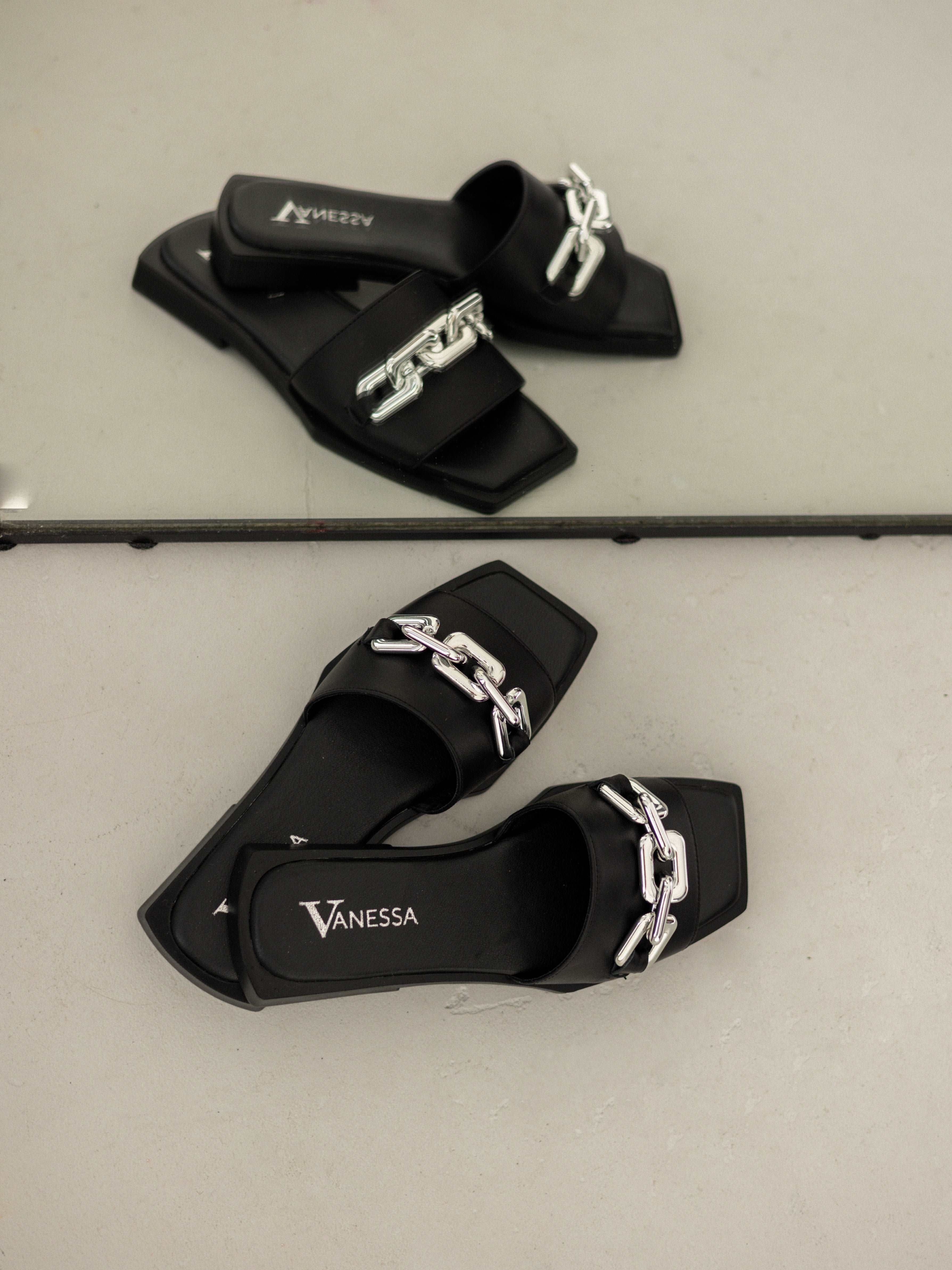 stylish black flip flops on a thin sole