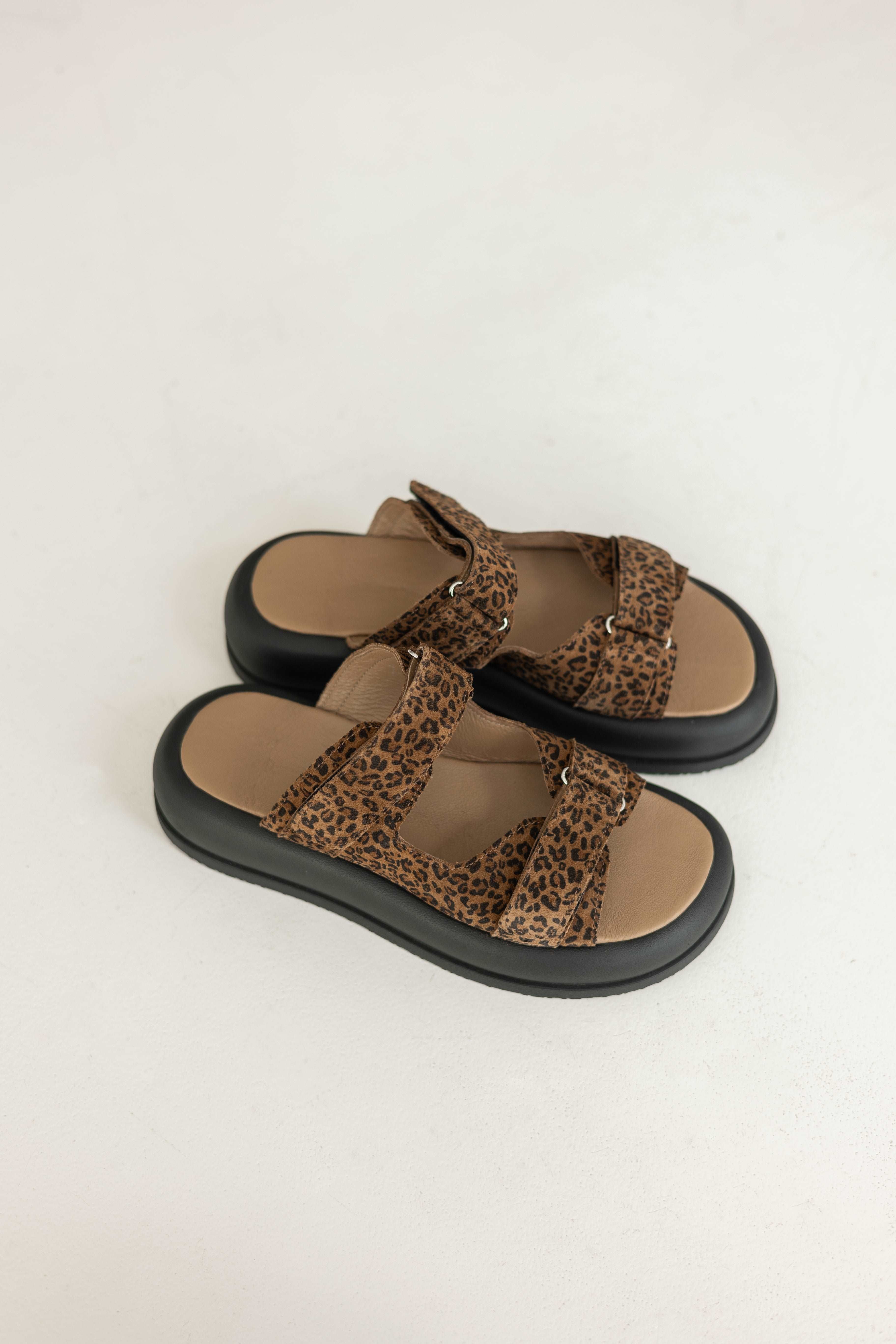 flip-flops on a massive sole with a leopard print